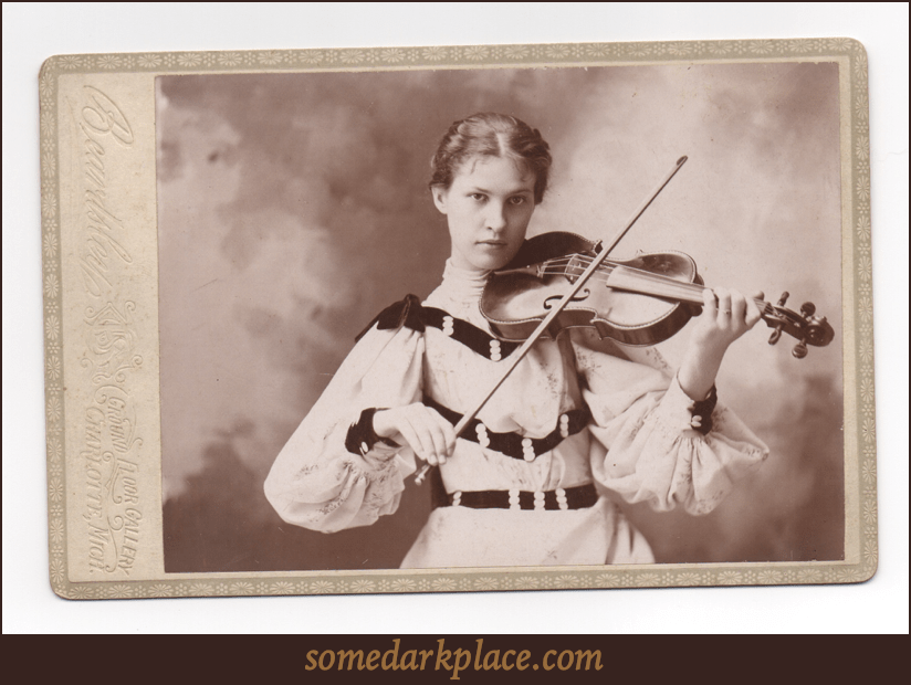 Fannie Fenn. An attractive woman holding a violin.